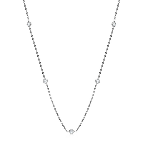 Silver-tone fine station chain necklace with tiny clear stations on a white background