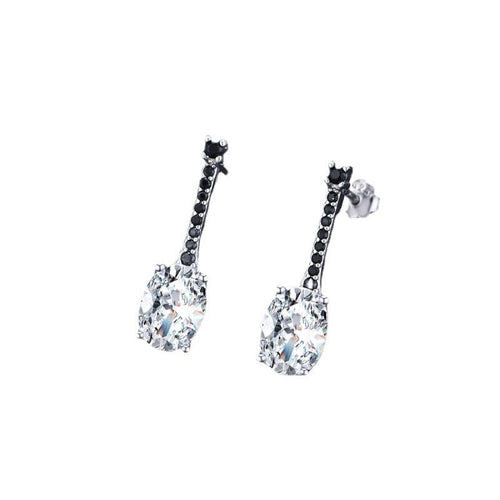 Silver-tone drop earrings with a clear oval zircon below a bar of tiny black stones, white background