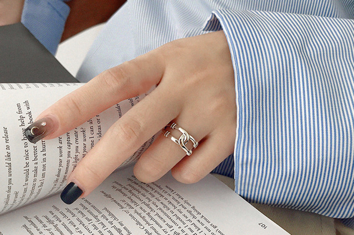 Silver-tone double band open ring worn on a hand