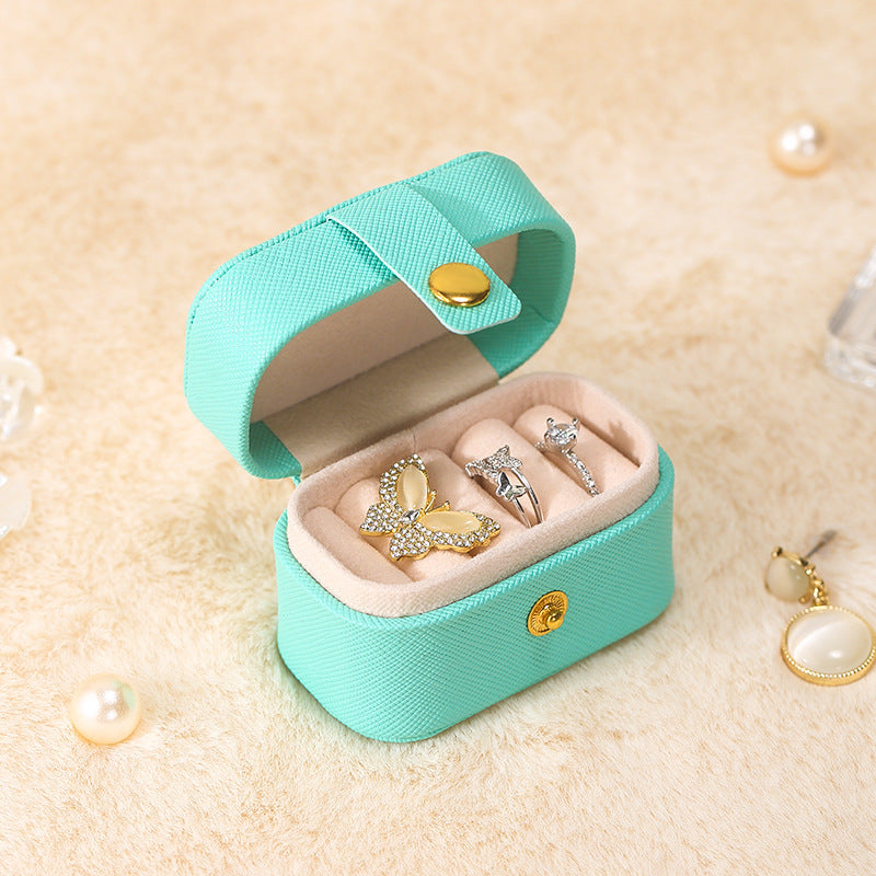 Aqua mini ring travel case with snap closure, open with rings