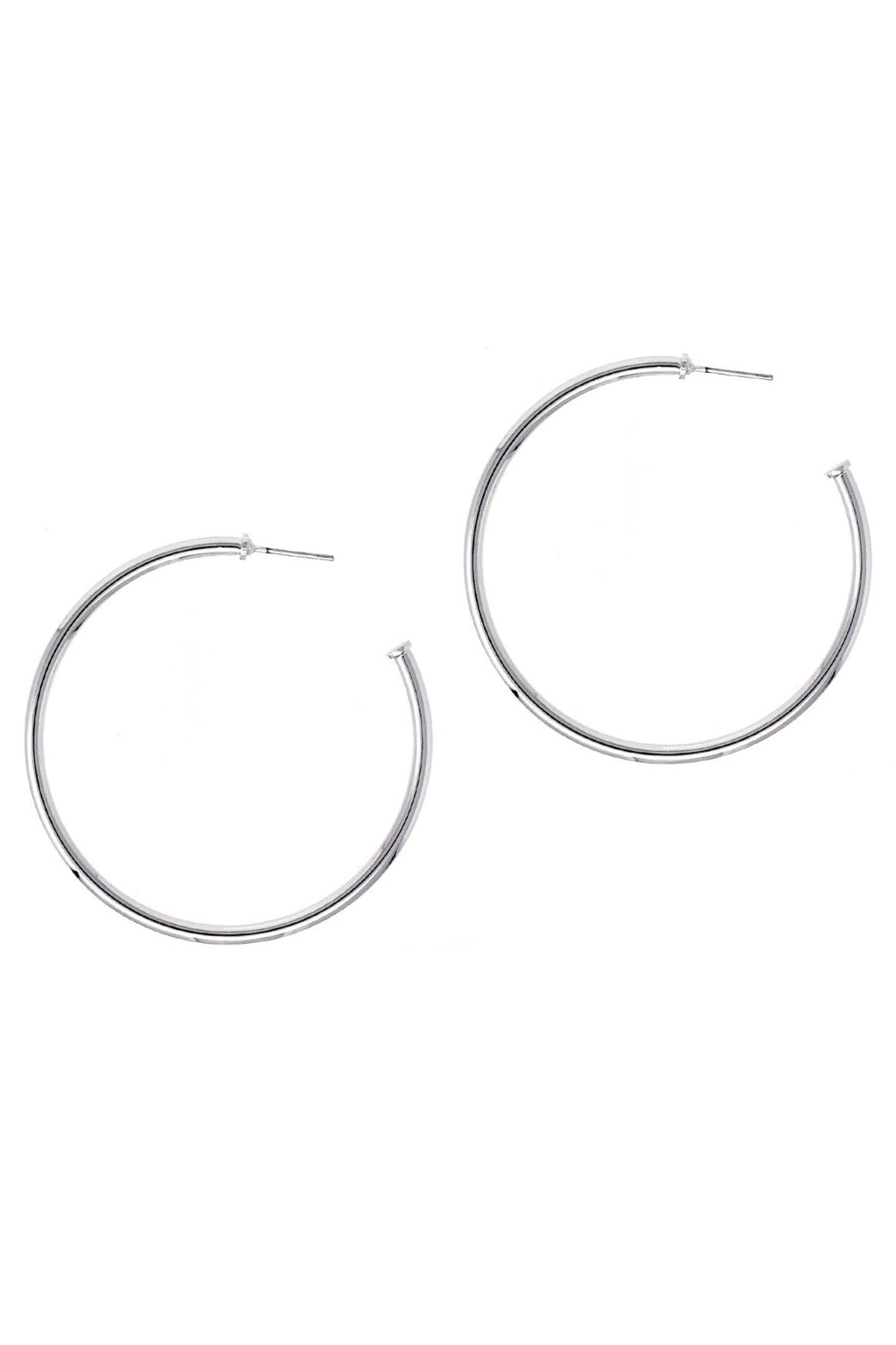 Pair of thin silver-tone hoop earrings with post backs on a white background