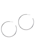 Pair of thin silver-tone hoop earrings with post backs on a white background