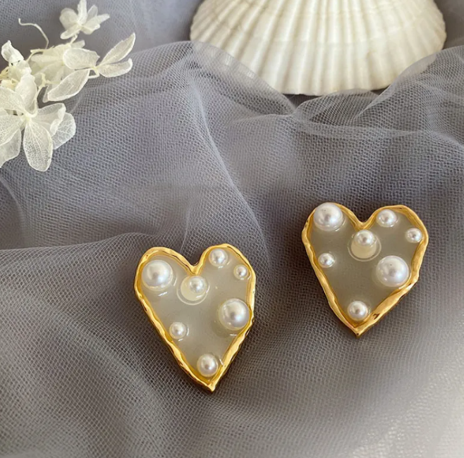 Pair of large heart-shaped earrings with pearl-style beads and a gold-tone rim