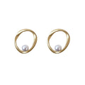 Pair of gold-tone open circle earrings with a pearl-style accent