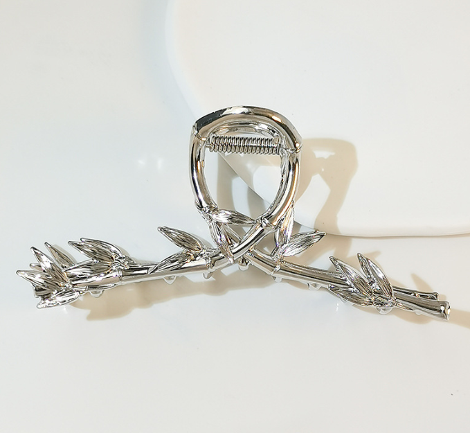 Silver-tone twig hair claw clip on a white background