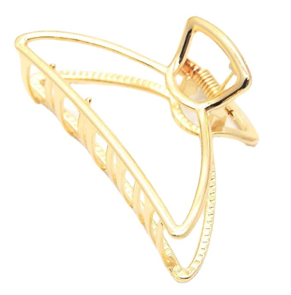 Gold-tone metal hair claw clip in the hair