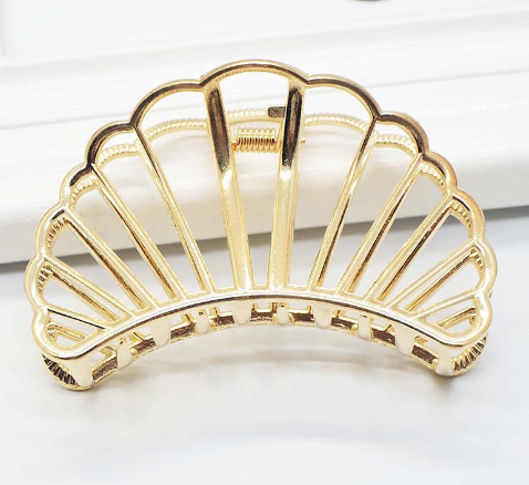 Gold-tone metal hair claw clips, group view