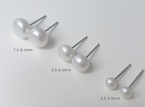 White pearl-style stud earrings in three sizes with silver-tone posts, size chart
