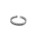 Silver-tone open band ring with a woven braided pattern and darkened recesses