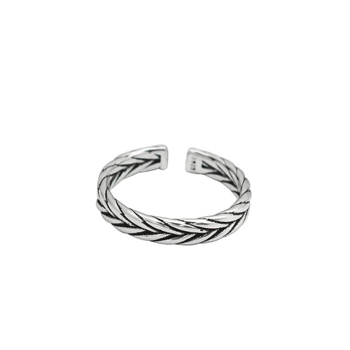 Silver-tone open band ring with a woven braided pattern and darkened recesses