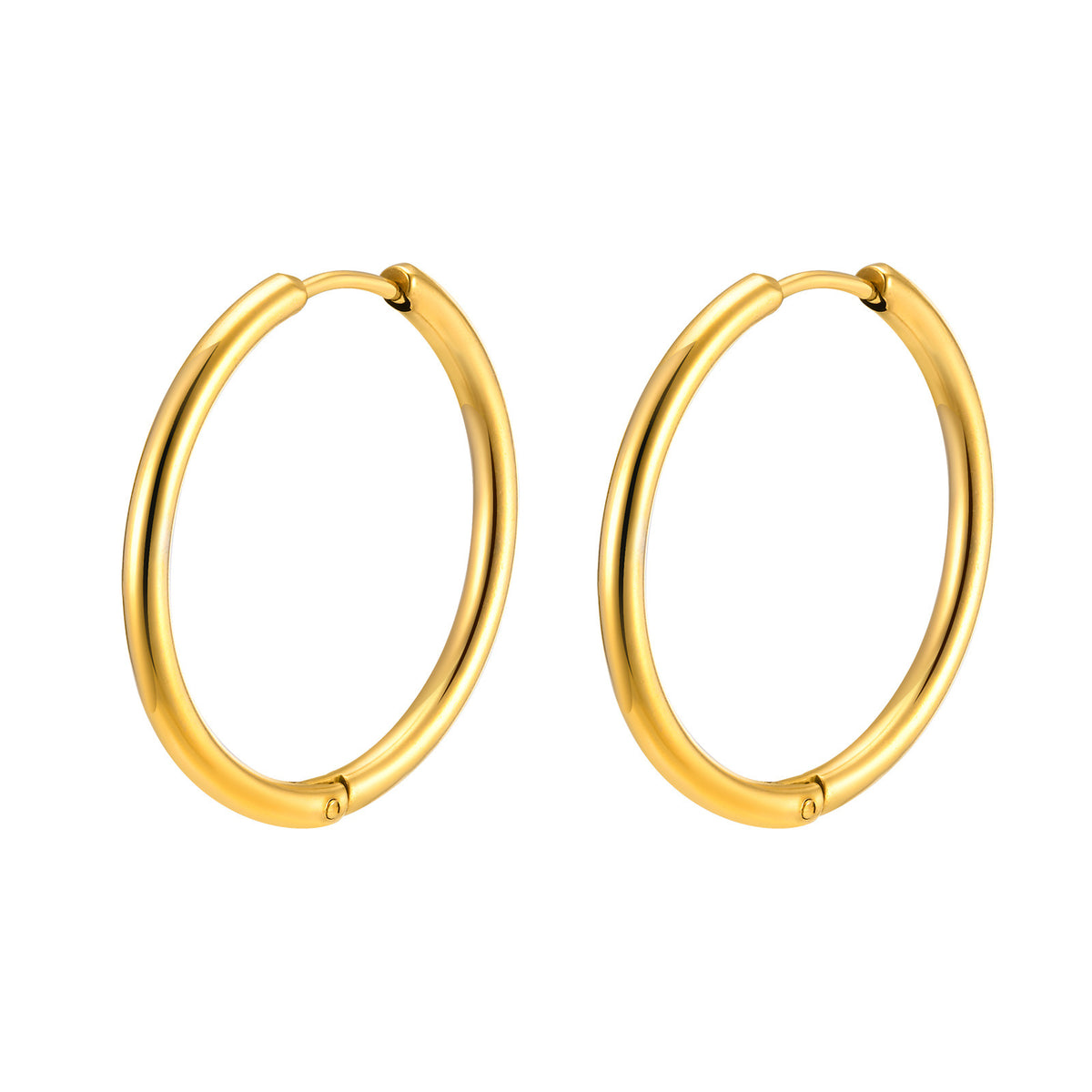 Pair of gold-tone huggie hoop earrings on a white background