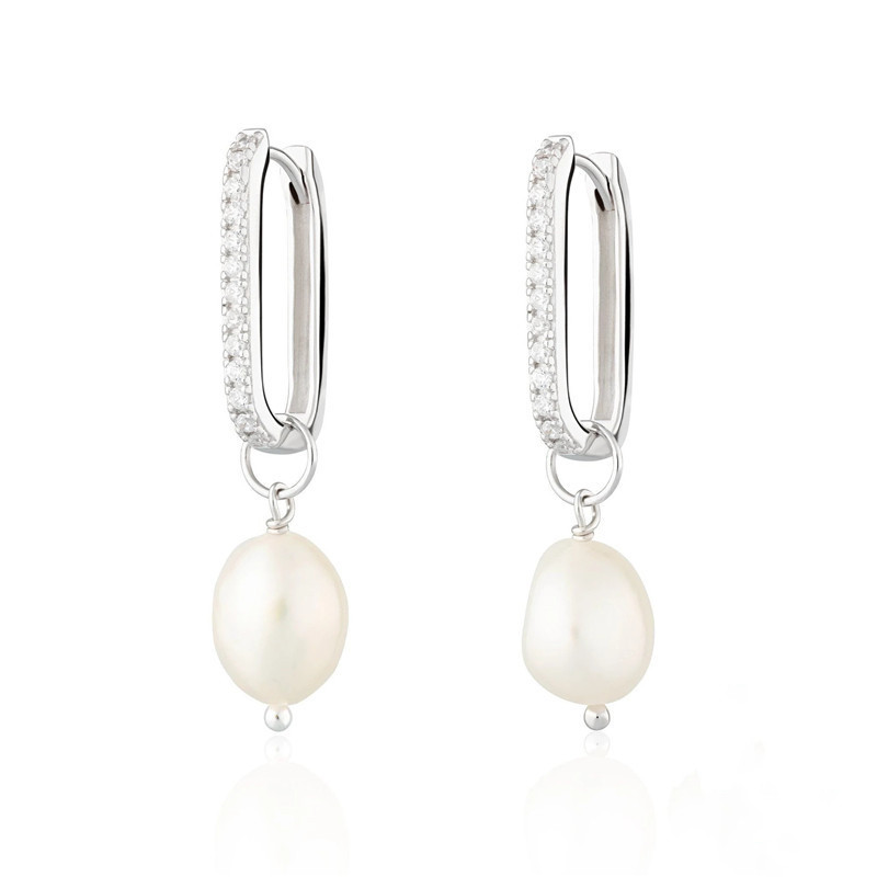 Silver-tone oval hoop earrings with a row of zircon stones and an irregular pearl-style drop