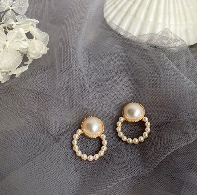 Pair of pearl-style bead ring drop earrings with a pearl-style button top on grey tulle