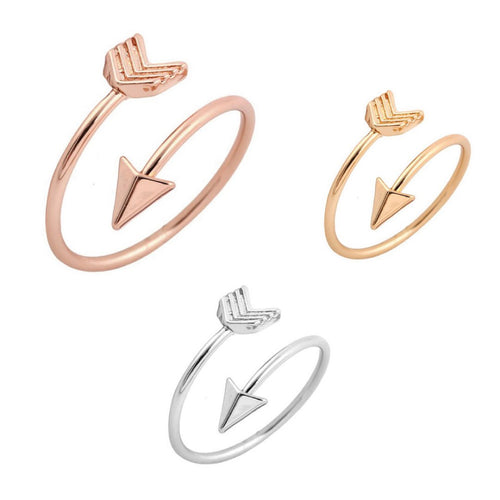 Adjustable arrow wrap rings in rose gold-tone, gold-tone and silver-tone on a white background