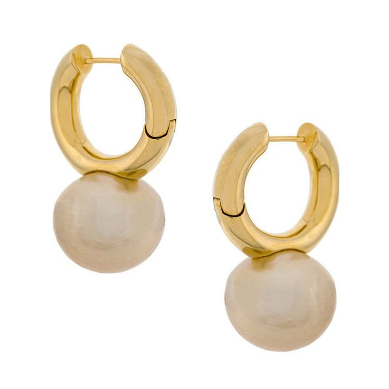 Pair of gold-tone huggie hoops with large cream pearl-style drops on white